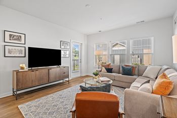 Spacious Living Area With Wood-Style Flooring